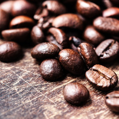 Top view of coffee beans on dark vintage background