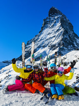 Ski, winter, snow - family enjoying winter vacation in Zermatt, Switzerland
