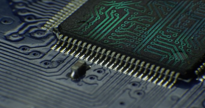 Macro shot on technology circuit board  rotating with CG and VFX . 4K 