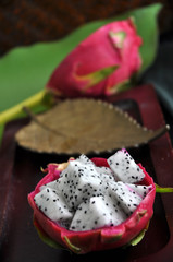 fresh dragon fruit on wooden tray