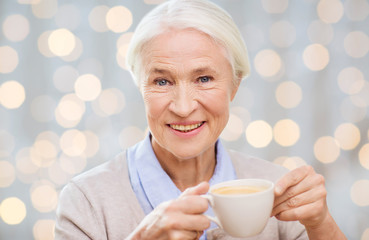 happy senior woman with cup of coffee