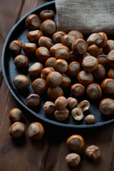 Close-up of a frying pan with hazelnuts, selective focus