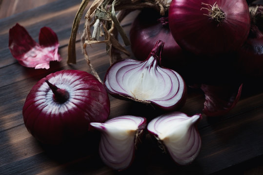 Close-up of whole and sliced red onion, selective focus