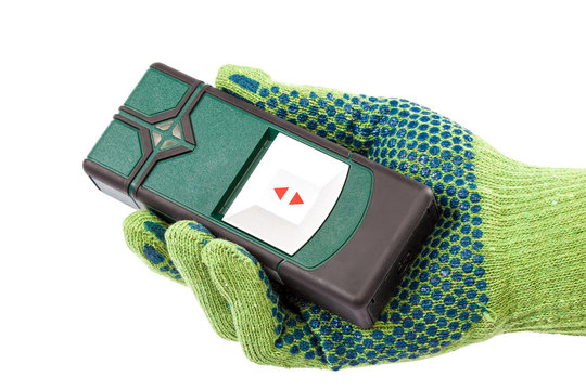 Modern laser measuring level in hand with glove.