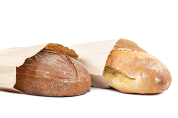 Bread in a paper bag on white background.