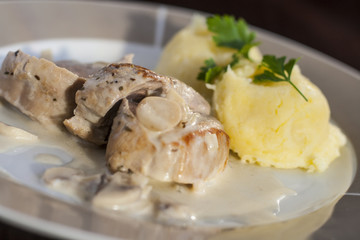 Roasted pork tenderloins with champignon mushroom gravy