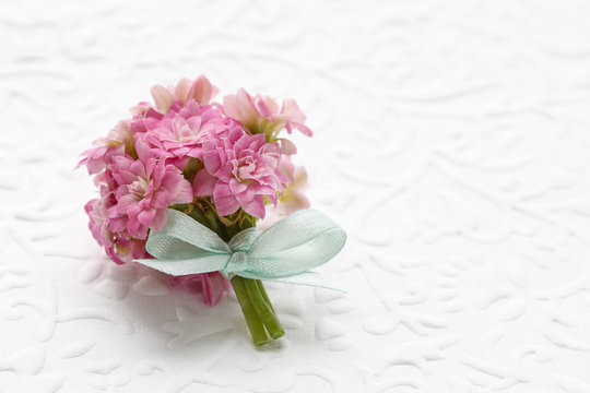 Beautiful tiny bouquet of pink kalanchoe blossfeldiana flowers a