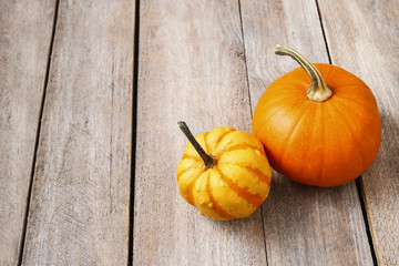 Pumpkins on wooden background