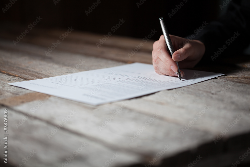 Wall mural woman hand signing document