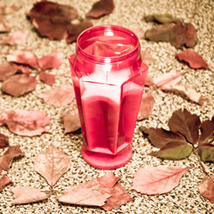 cemetery red lantern candle with autumn leaves 