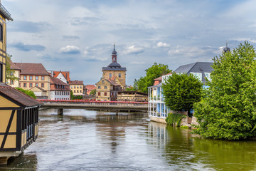 Fototapeta na wymiar Bamberg. A scenic view of the Regnitz river the old town hall (1461), bridges and old buildings on artificial islands
