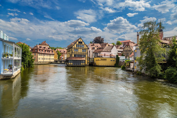 Fototapeta na wymiar Bamberg. The old half-timbered houses on the banks and islands of the Regnitz river. Historic city center of Bamberg is a listed UNESCO world heritage site
