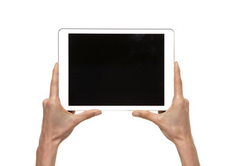 Tablet in hands. Studio shot isolated on white. 