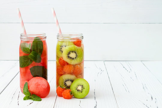 Detox fruit infused flavored water. Refreshing summer homemade cocktail. Clean eating. Copy space background