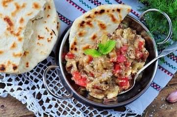 Eggplant caviar (salad) with tomato, white onion, olive oil and sea salt with lavash bread