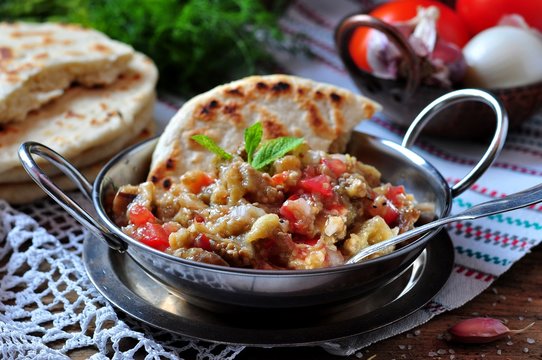 Eggplant caviar (salad) with tomato, white onion, olive oil and sea salt with lavash bread