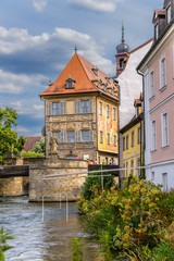 Bamberg, Germany. Old Town Hall with frescoes on the facade, Lower Bridge and the Monument of St. Kunigunde. Historic city center of Bamberg is a listed UNESCO world heritage site