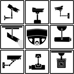Nine black and white surveillance camera icons or stickers 