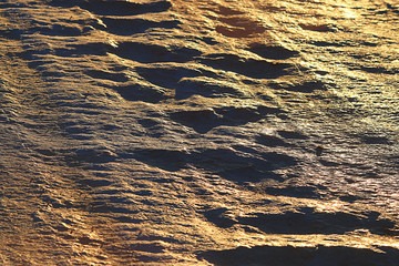 golden background uneven pits