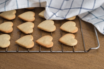 Heart shaped valentine's butter cookies cooling on the rack