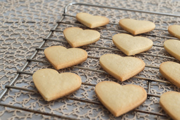 Heart shaped valentine's butter cookies cooling on the rack