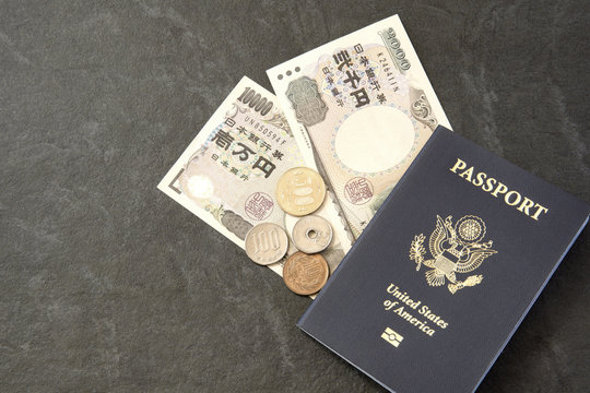 US Passport and Japanese Currency