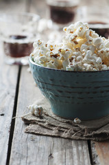Popcorn and cola on the wooden table