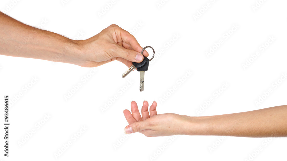 Wall mural hand giving a key isolated on white background