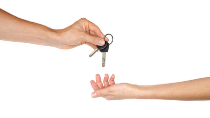 Hand giving a key isolated on white background