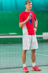 Professional tennis player standing