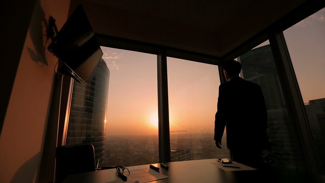 businessman looking out the window in a contemplative way, Dolly