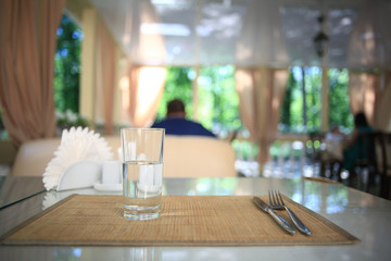 glass of water on a table in a restaurant