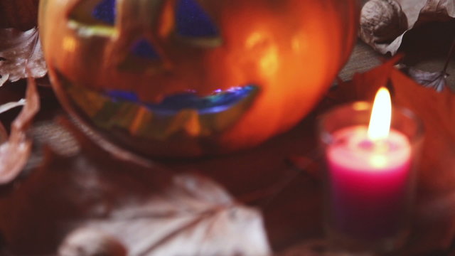 motion of kind still life pumpkin with candle for halloween celebration