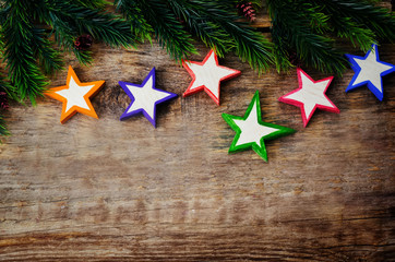 wooden background with wooden toys in the shapes of stars and th