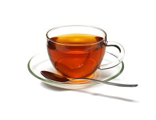 Glass cup with black tea and spoon