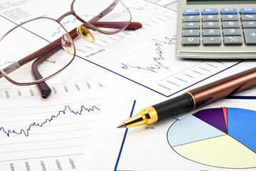  Business background, financial data concept with pen and glasse