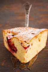 Pie with plums in powdered sugar.selective focus