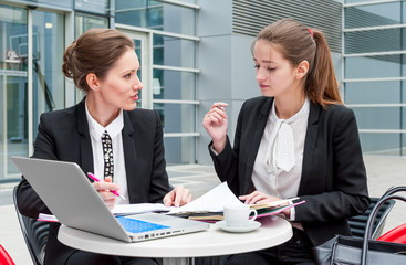 Two young business women