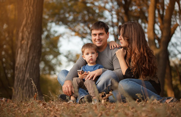 Fototapeta premium Happy family in autumn forest