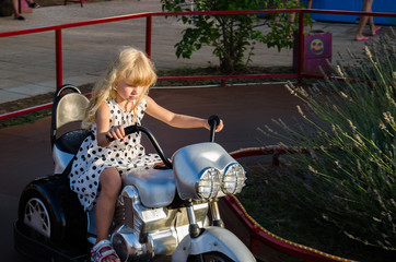 little girl on motorbike © katarinagondova