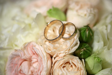 Wedding rings on flowers