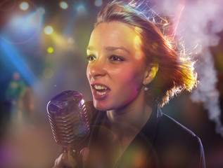 Close-up portrait of woman singer