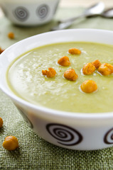 Green cream soup made of spinach, broccoli and peas
