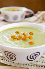 Green cream soup made of spinach, broccoli and peas