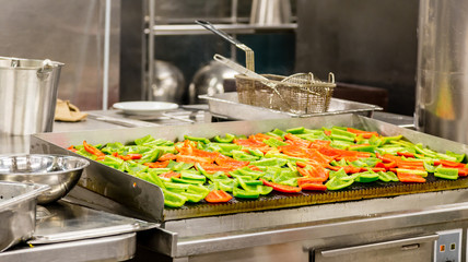 Red and Green Peppers on a Grill