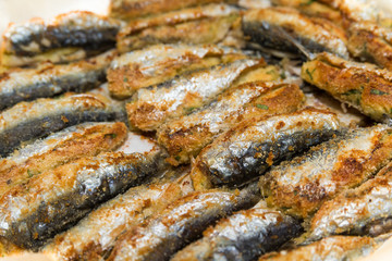Breaded and stuffed sardines, closeup 