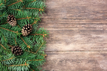 Christmas fir tree on a wooden background