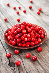 fresh red berries on wooden table