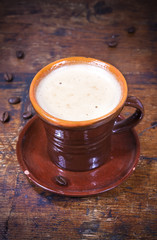 cup of coffee on wooden table