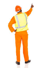 rear view of african contractor pointing